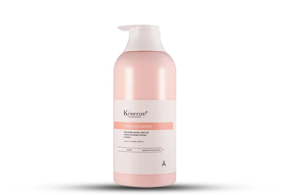 Front label of bottle Kósenze Ultra Repair Shampoo featuring a salmon pink accent stripe.