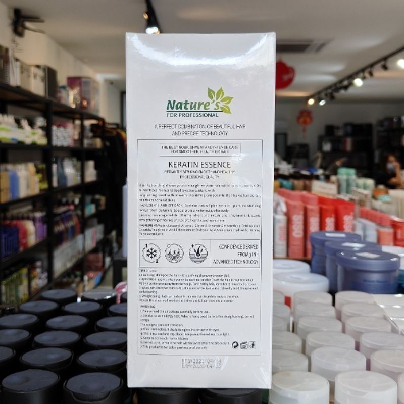 back label of Nature's For Professional Hair Rebonding Keratin Essence 1000ml white and green packaging box in a retail store.